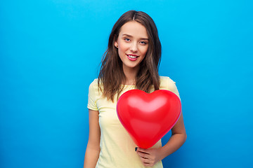 Image showing teenage girl with red heart-shaped balloon