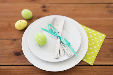 Image showing easter egg in cup holder, plates and cutlery