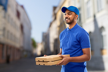 Image showing happy indian delivery man with pizza boxes in city