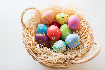 Image showing close up of colored easter eggs in basket