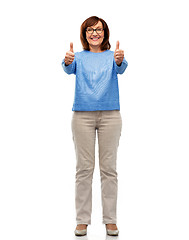 Image showing happy smiling senior woman showing thumbs up