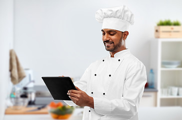 Image showing happy indian chef with tablet computer at kitchen