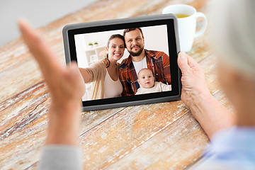 Image showing family having video call on tablet computer