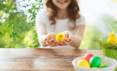Image showing close up of girl holding yellow toy chicken