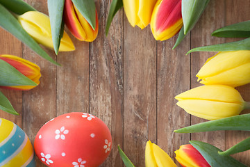 Image showing close up of colored easter eggs and tulip flowers