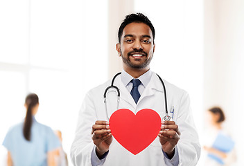 Image showing smiling indian male doctor with red heart shape