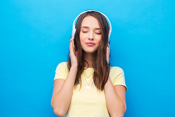 Image showing happy young woman or teenage girl with headphones