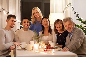 Image showing happy family having tea party at home