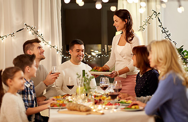 Image showing happy family having dinner party at home