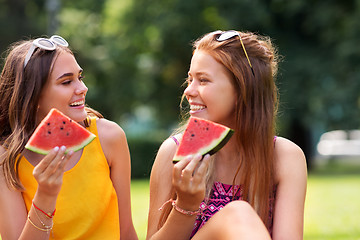 Image showing teenage girls eating watermelon at picnic in park
