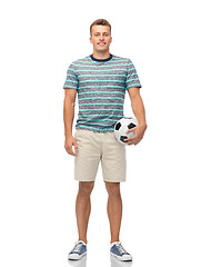 Image showing smiling young man with soccer ball