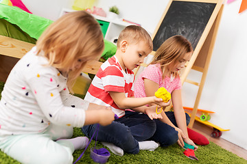 Image showing children with modelling clay or slimes at home