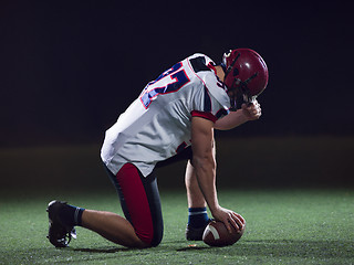 Image showing American football player starting football game