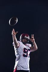 Image showing american football player throwing rugby ball