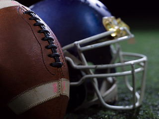 Image showing closeup of american football and helmet