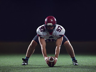 Image showing American football player starting football game