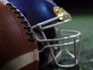 Image showing closeup of american football and helmet
