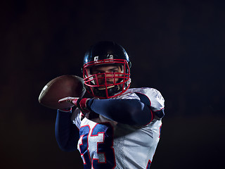 Image showing american football player throwing rugby ball