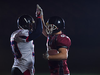Image showing american football players celebrating after scoring a touchdown