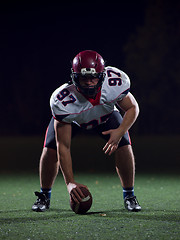 Image showing American football player starting football game