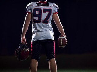 Image showing rear view of young confident American football player