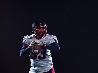 Image showing american football player celebrating after scoring a touchdown