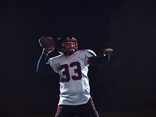 Image showing american football player throwing rugby ball