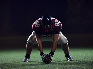 Image showing American football player starting football game