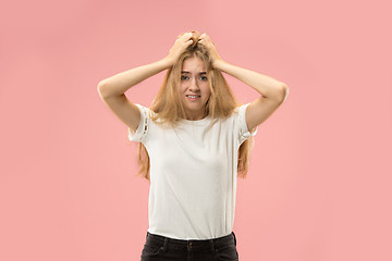 Image showing Beautiful woman looking suprised and bewildered isolated on pink