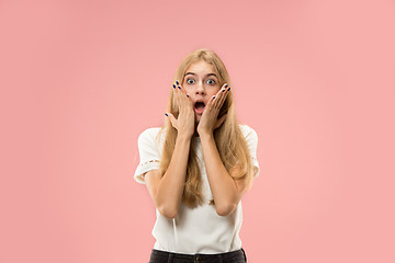 Image showing Beautiful woman looking suprised isolated on pink