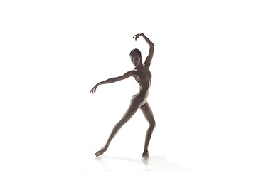 Image showing Ballerina. Young graceful female ballet dancer dancing isolated on white. Beauty of classic ballet.