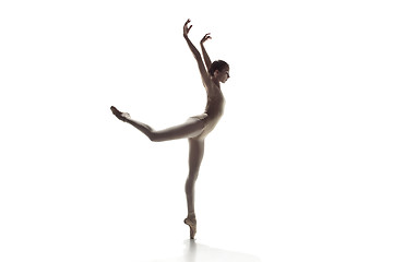 Image showing Ballerina. Young graceful female ballet dancer dancing isolated on white. Beauty of classic ballet.