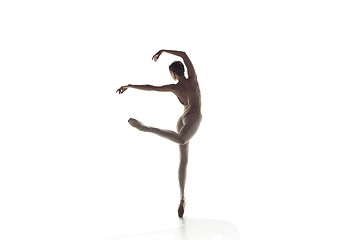 Image showing Ballerina. Young graceful female ballet dancer dancing isolated on white. Beauty of classic ballet.