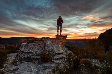 Image showing Female hiker taking in heavenly views of mountains and valleys