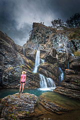 Image showing Moody skies, limestone cliffs, waterfalls and blue waterholes