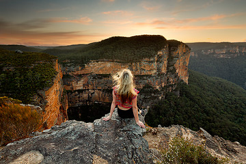 Image showing Sitting on rock watching the sunset mountain views