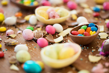 Image showing chocolate easter eggs and candy drops on table