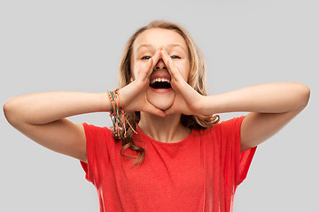 Image showing happy teenage girl in red t-shirt shouting