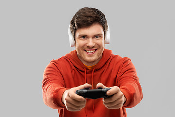 Image showing man with gamepad playing video game