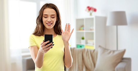 Image showing smiling teenage girl having video call smartphone