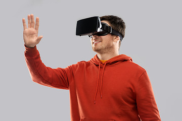 Image showing happy man in virtual reality headset or vr glasses