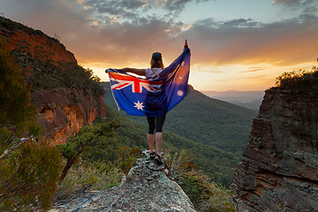 Image showing Patriotic woman holding Australian flag in Blue Mountains Austra