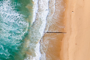 Image showing Aerial view of beach with surfers