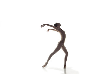 Image showing Ballerina. Young graceful female ballet dancer dancing isolated on white. Beauty of classic ballet.