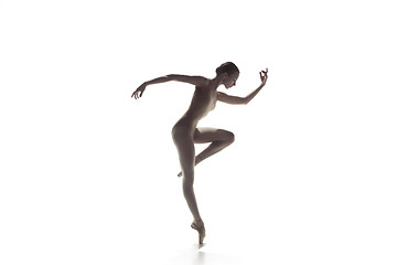 Image showing Ballerina. Young graceful female ballet dancer dancing isolated on white. Beauty of classic ballet.