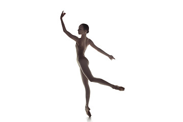 Image showing Ballerina. Young graceful female ballet dancer dancing isolated on white. Beauty of classic ballet.