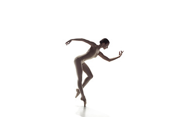 Image showing Ballerina. Young graceful female ballet dancer dancing isolated on white. Beauty of classic ballet.