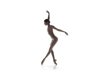 Image showing Ballerina. Young graceful female ballet dancer dancing isolated on white. Beauty of classic ballet.