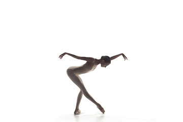 Image showing Ballerina. Young graceful female ballet dancer dancing isolated on white. Beauty of classic ballet.