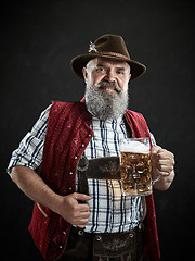 Image showing Germany, Bavaria, Upper Bavaria, man with beer dressed in in traditional Austrian or Bavarian costume